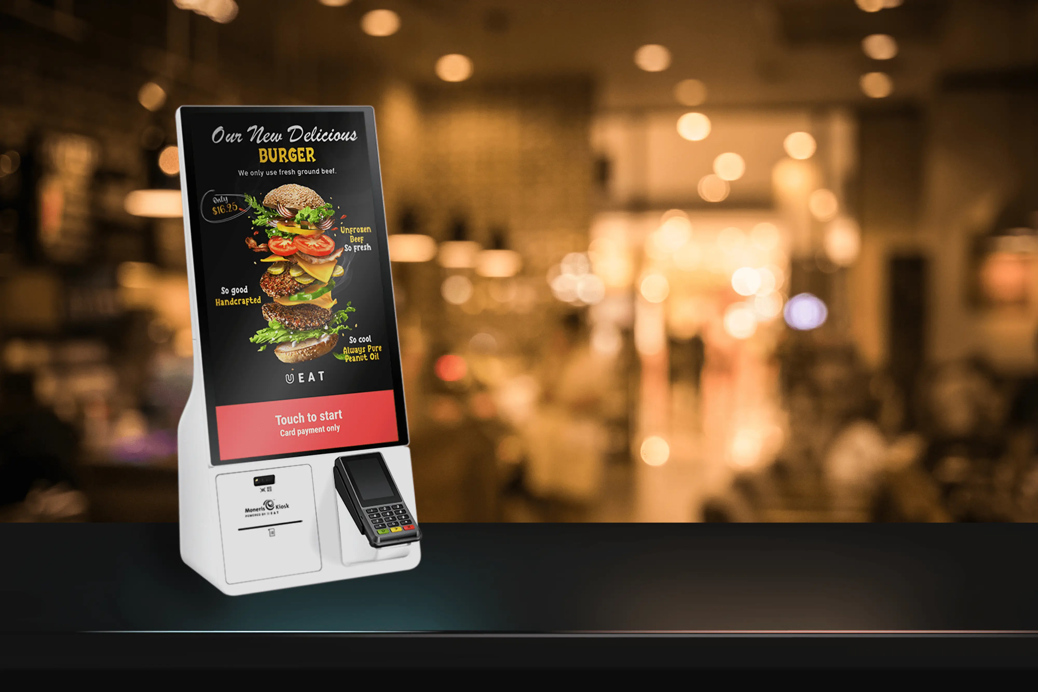 Moneris Kiosk Powered by UEAT Samsung self ordering kiosk on a counter in an ambient restaurant.